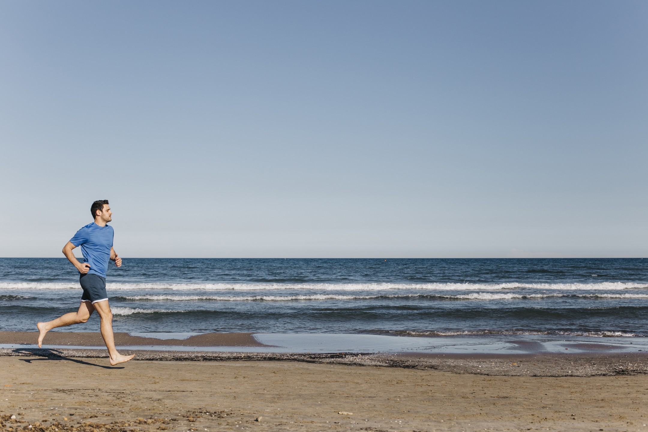 man-jogging-beach